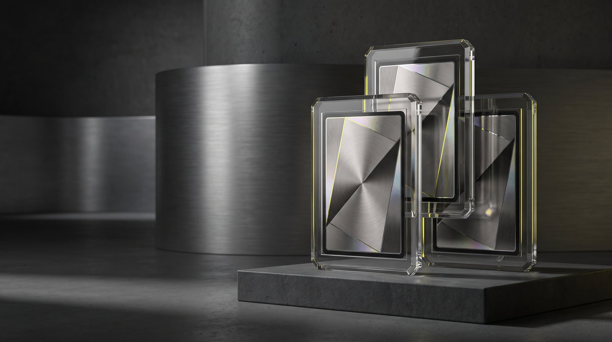 Conceptual studio arrangement of silver card holders with a yellow accent